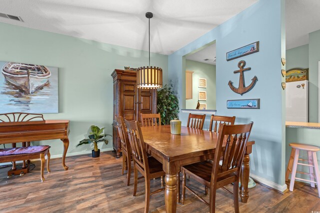 2080 Cross Gate Blvd Unit 303, Surfside Beach, SC 29575 - dining room with wood finished floors and baseboards