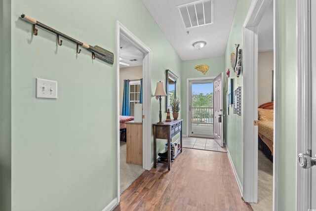 2080 Cross Gate Blvd Unit 303, Surfside Beach, SC 29575 - hallway featuring light wood-style floors and baseboards