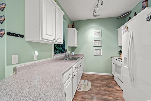 2080 Cross Gate Blvd Unit 303, Surfside Beach, SC 29575 - kitchen featuring white appliances, a sink, white cabinetry, dark wood finished floors, and light countertops