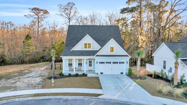 view of front of home featuring a garage and covered porch