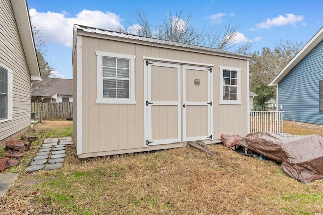 view of outdoor structure featuring a yard