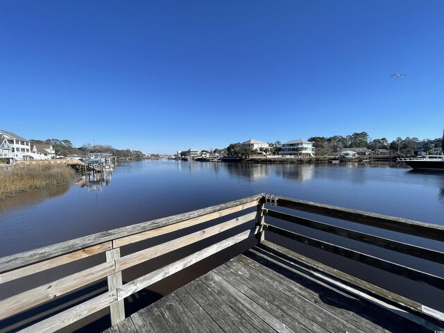 dock area featuring a water view