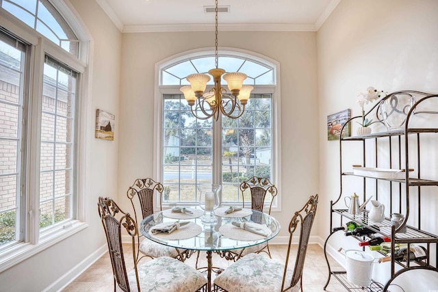 dining room with ornamental molding, a wealth of natural light, and an inviting chandelier