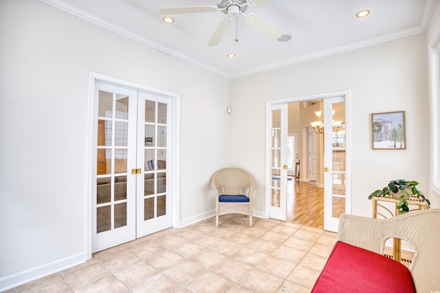 sitting room featuring french doors, ornamental molding, and light tile patterned flooring