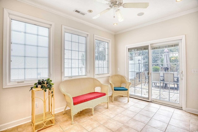 living area with light tile patterned floors, ceiling fan, and crown molding