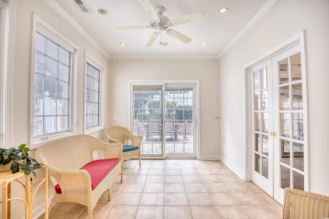 living area featuring ceiling fan, french doors, light tile patterned floors, and ornamental molding