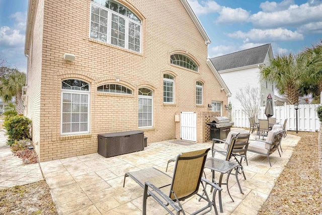 view of patio featuring a grill