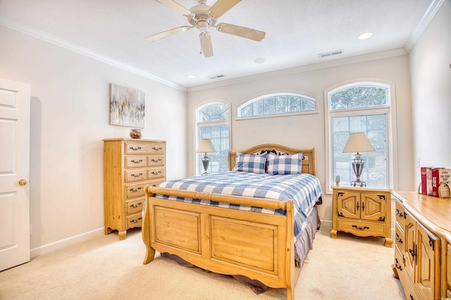 bedroom with multiple windows, ceiling fan, crown molding, and light colored carpet