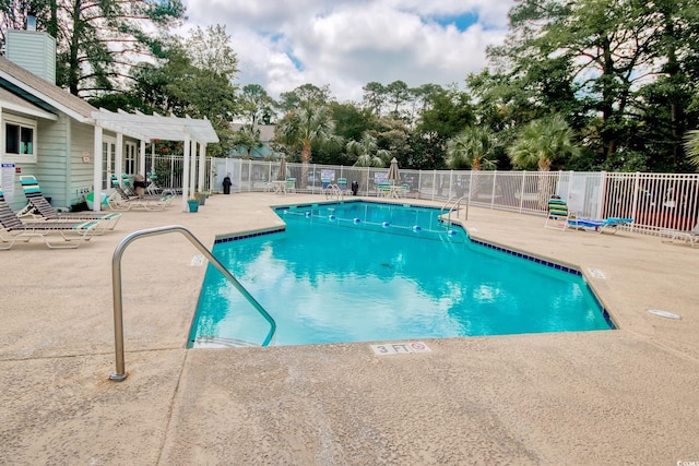 view of swimming pool featuring a patio and a pergola