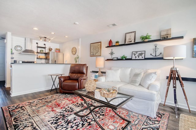 living room with dark hardwood / wood-style flooring