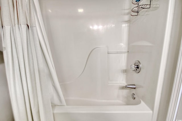 bathroom with shower / tub combo with curtain