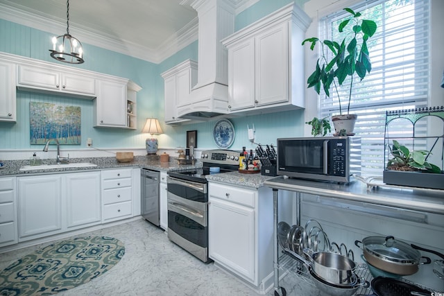 kitchen featuring white cabinets, appliances with stainless steel finishes, sink, and an inviting chandelier