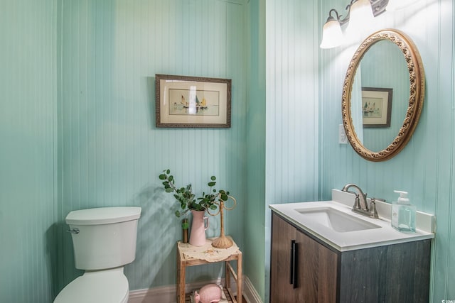 bathroom featuring toilet and vanity