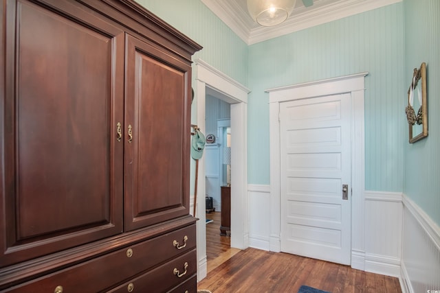 interior space featuring dark wood-type flooring and crown molding