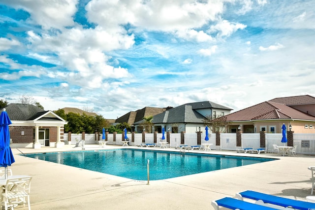 view of swimming pool featuring a patio area