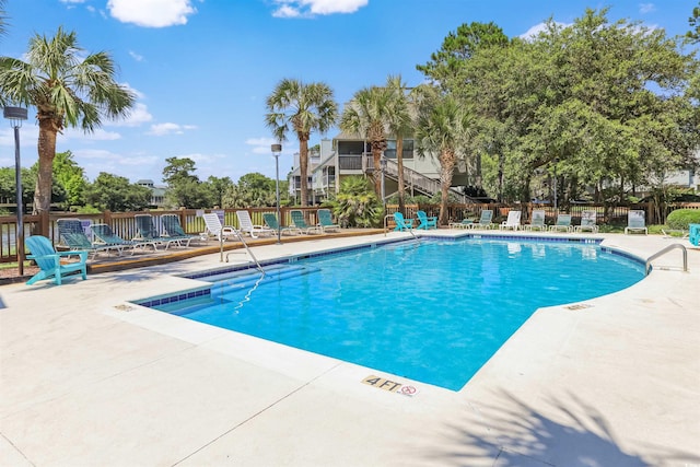 view of pool featuring a patio