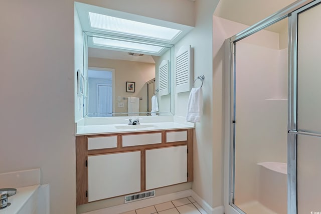 bathroom with vanity, tile patterned floors, and an enclosed shower