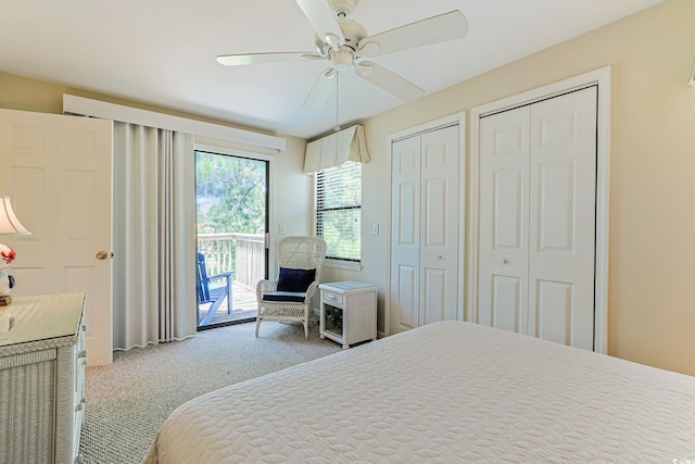 bedroom featuring access to exterior, ceiling fan, carpet floors, and multiple closets