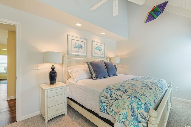 bedroom featuring light carpet, ceiling fan, and lofted ceiling