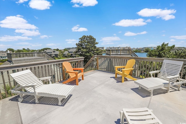 view of patio with a water view