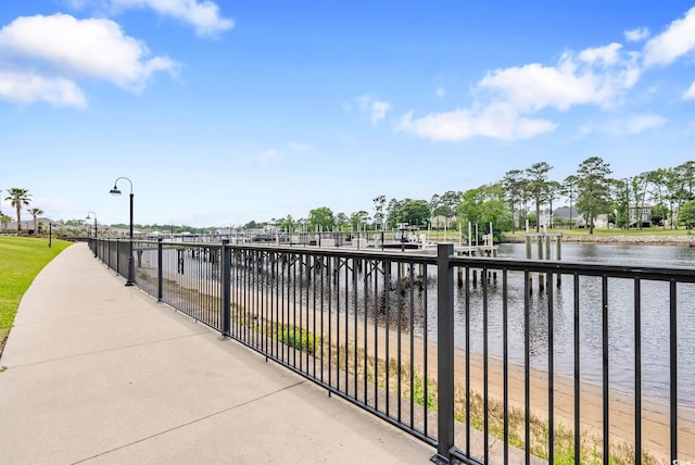 exterior space with a dock and a water view