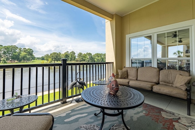 balcony featuring outdoor lounge area and a water view