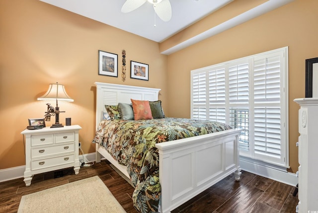 bedroom featuring ceiling fan, baseboards, and dark wood-style floors