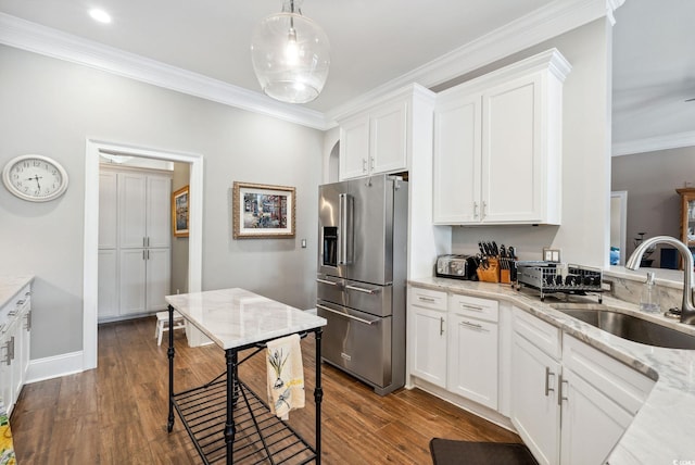 kitchen with crown molding, dark wood-style floors, stainless steel fridge with ice dispenser, and white cabinets