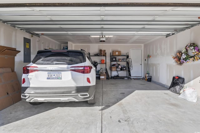 124 Golden Bear Cir, Longs, SC 29568 - garage with electric panel and a garage door opener