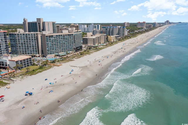 drone / aerial view with a beach view and a water view