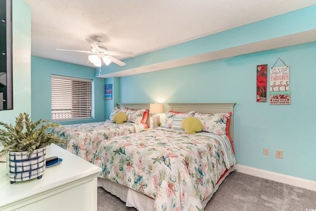 bedroom with carpet flooring, a textured ceiling, and ceiling fan