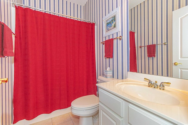 bathroom featuring tile patterned floors, a shower with curtain, vanity, a textured ceiling, and toilet