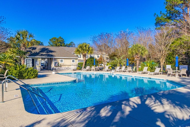 view of swimming pool with a patio