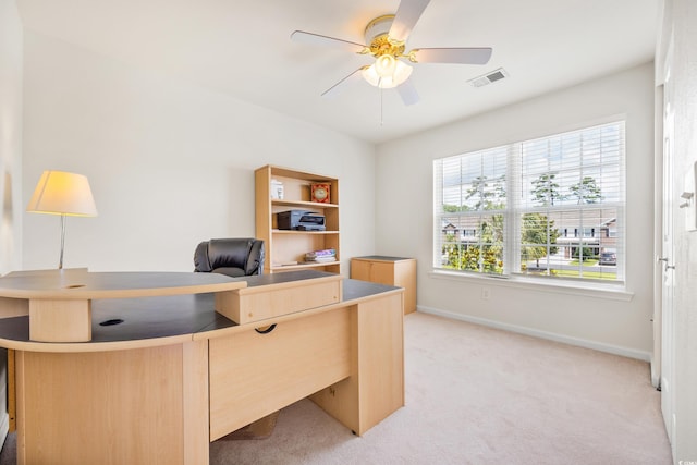 office with ceiling fan and light carpet