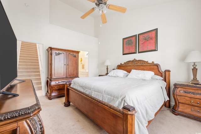 bedroom featuring light carpet and ceiling fan