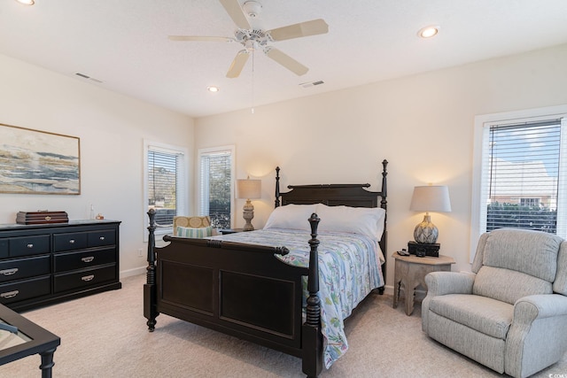 bedroom with light colored carpet and ceiling fan