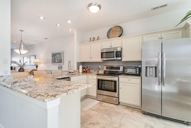 kitchen with backsplash, stainless steel appliances, light stone countertops, decorative light fixtures, and kitchen peninsula