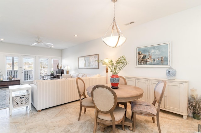 dining space with ceiling fan