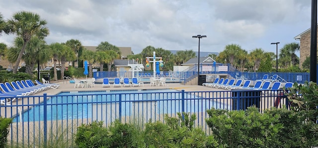 241 Presidential Dr, Surfside Beach, SC 29575 - community pool featuring a patio area