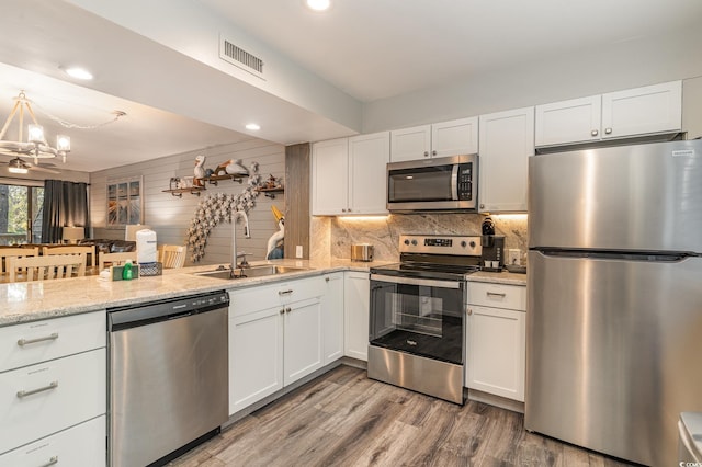 kitchen with white cabinets and stainless steel appliances