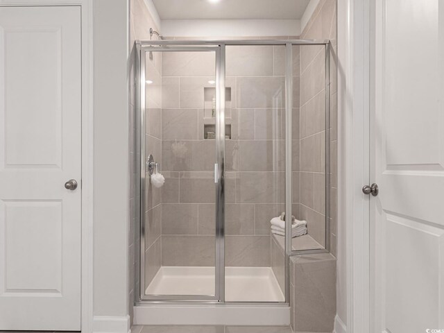 5032 Riverton Ct, Myrtle Beach, SC 29579 - bathroom with a shower with shower door