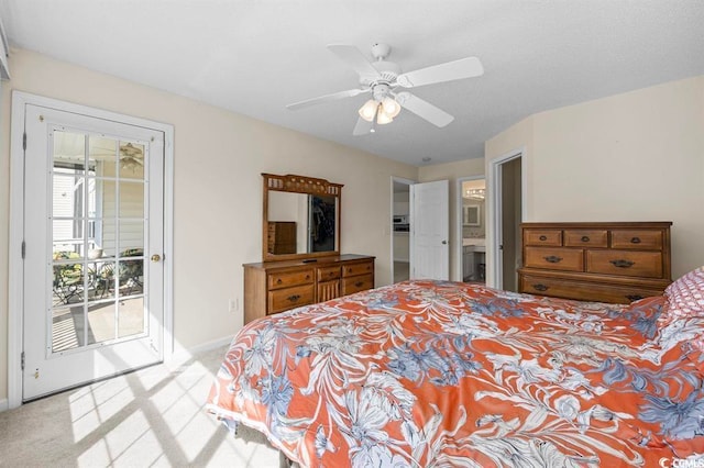 carpeted bedroom with access to outside, baseboards, ceiling fan, and ensuite bathroom