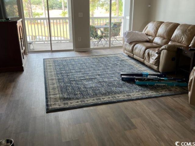 living room with wood finished floors