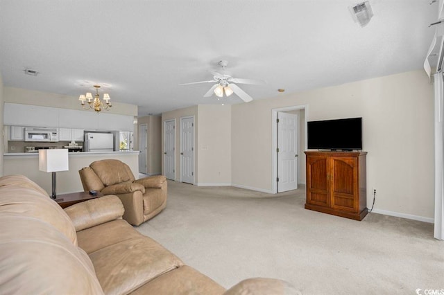 living room with light carpet, visible vents, and baseboards