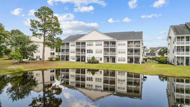 view of property with a water view