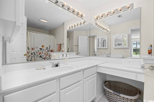 bathroom with visible vents and vanity