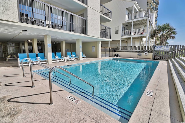 view of swimming pool with a patio area