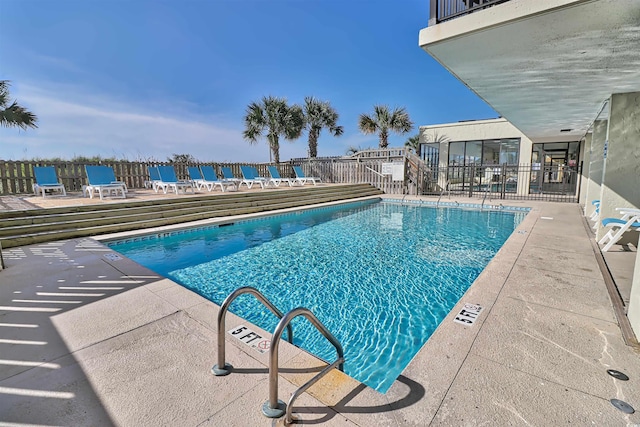 view of pool featuring a patio area