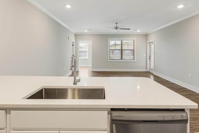 kitchen with dishwasher, ceiling fan, ornamental molding, and sink