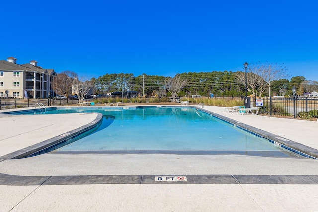 view of swimming pool with a patio area